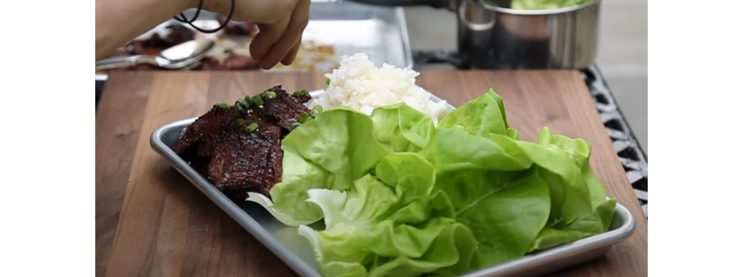 This image shows a shorts rib, rice and lettuce