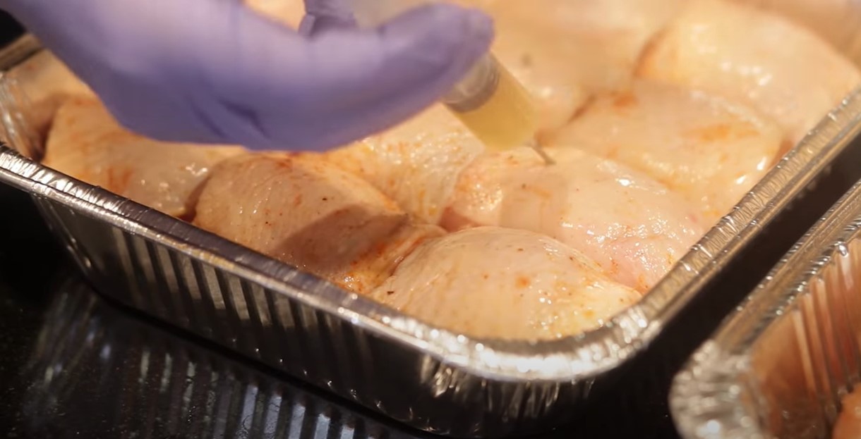 This image shows how to inject a marinade made from Kosmos Q Original Chicken Injection