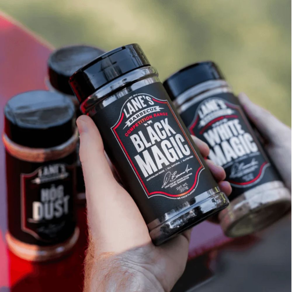 Lane's Black Magic BBQ Rub with other rubs in the background.      