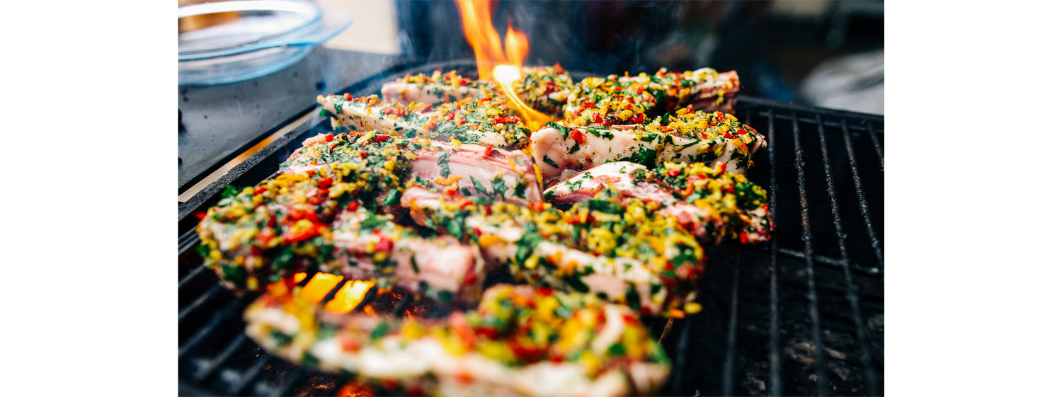 This image shows lamb cutlets on grill
