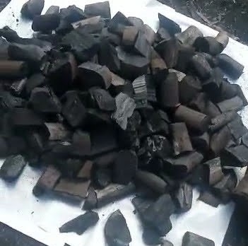 Image of an open bag of natural lump charcoal. All pieces a large and very good quality
