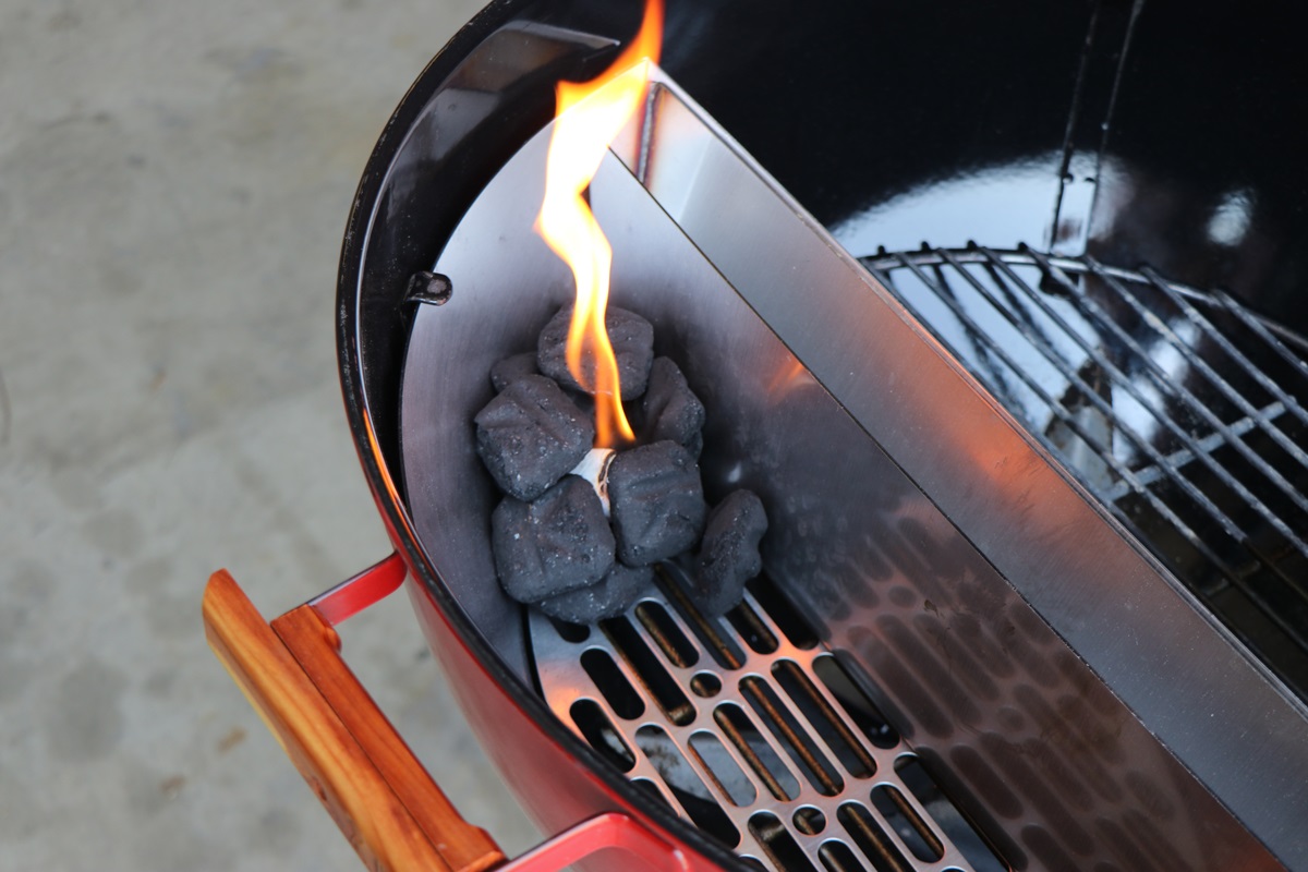 This is a picture on coal being lit in the  Slow N Sear charcoal Basket