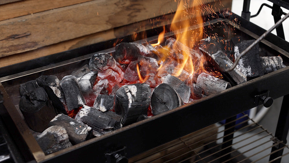 This image shows lit charcoal for cooking chicken wings