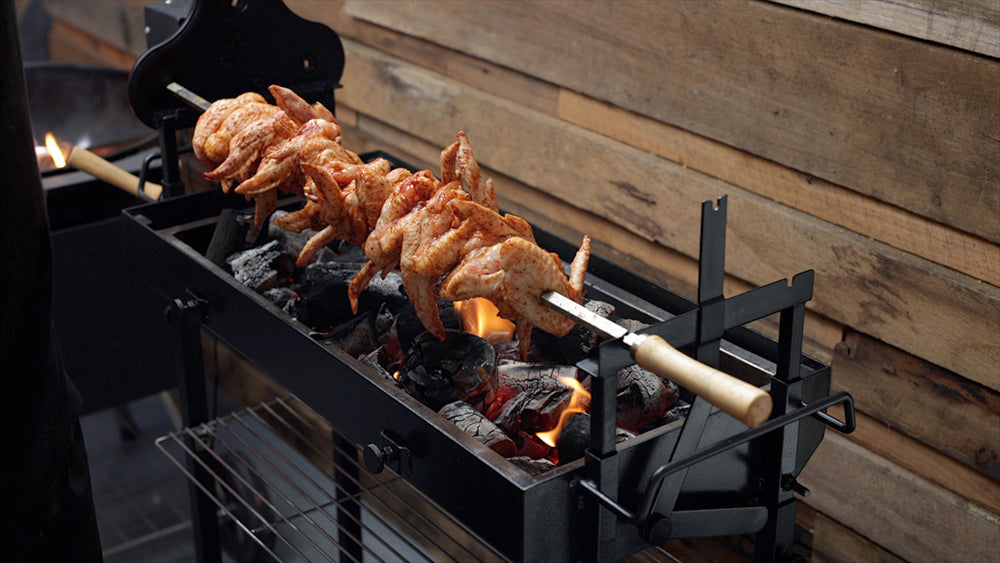 This image shows chicken wings in loaded in the skewer cooked in Cyprus Spit Roaster