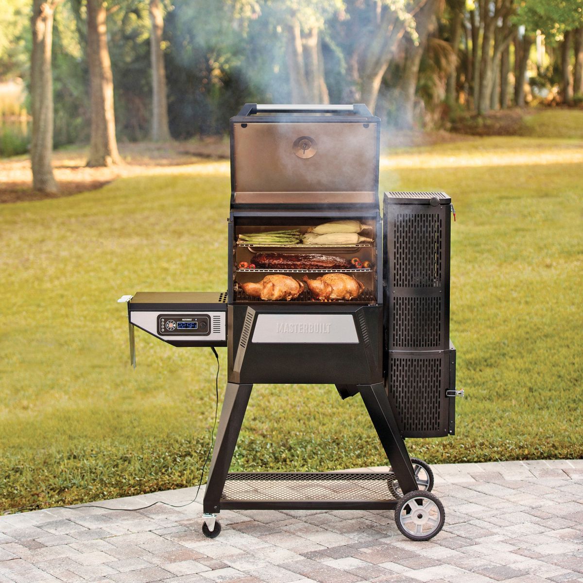 Masterbuilt Gravity Feed Smoker cooking whole chickens and vegetables with digital temperature control.