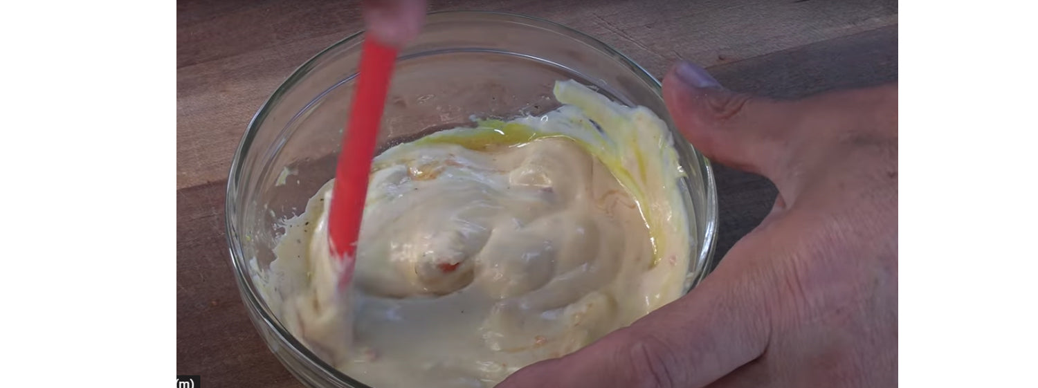 This images shows mayonaise, ketchup and other spices in a bowl