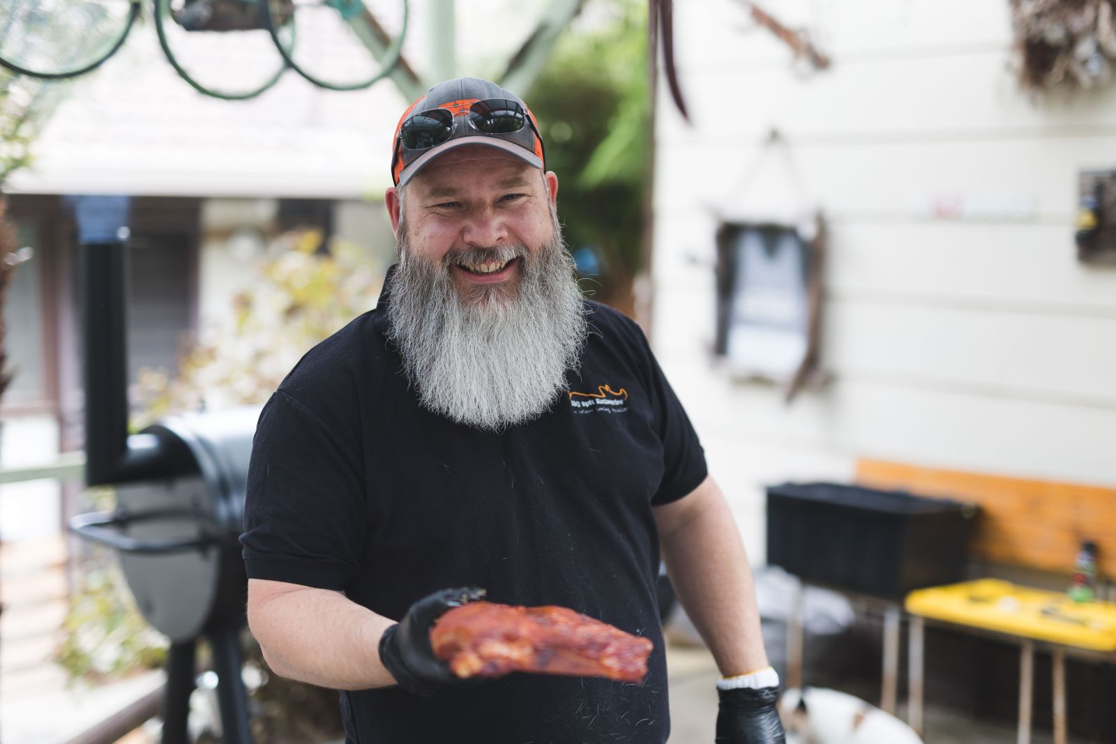 This photo shows one of our pitmasters smoking meat.