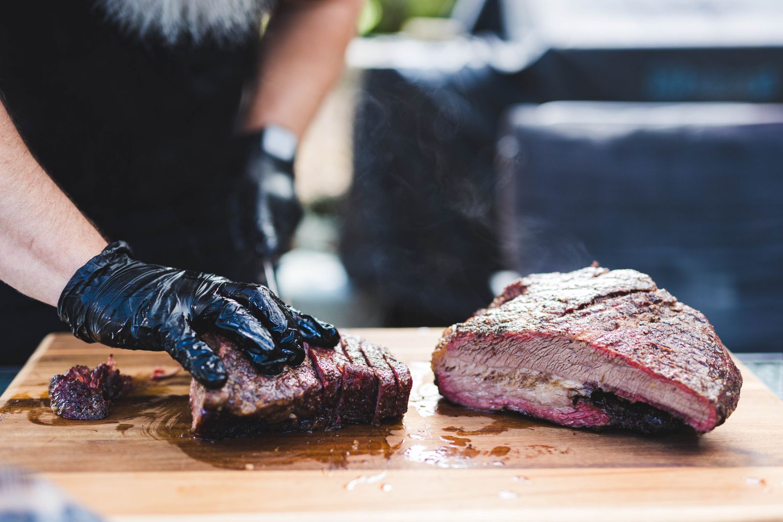 This photo shows smoked meat being sliced.