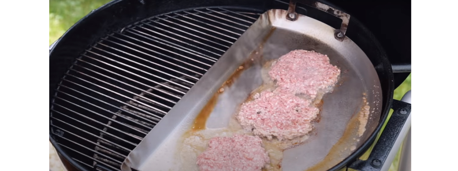 This image shows three pieces of meat on drip 'n griddle pan
