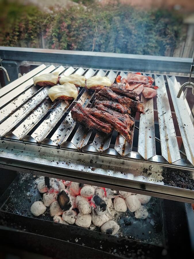 This_image_shows_meat_being_cooked_in_Parrilla_grill