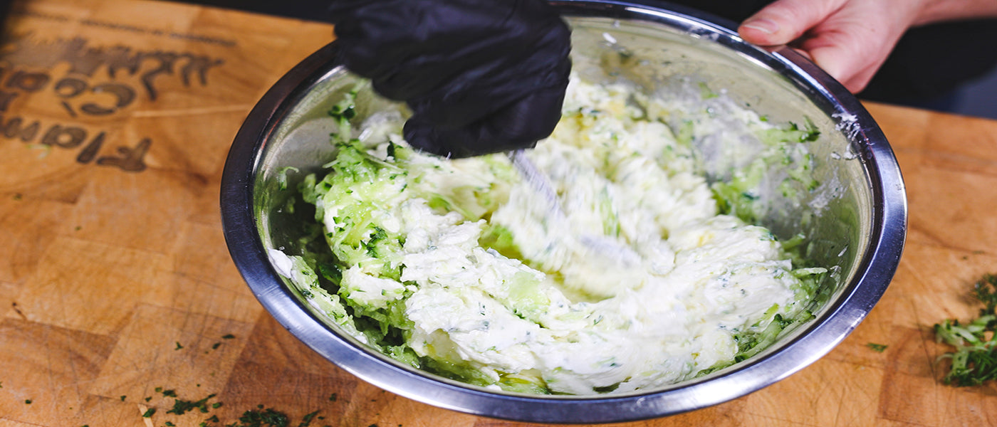 This image shows a man mixing the yoghurt mixture