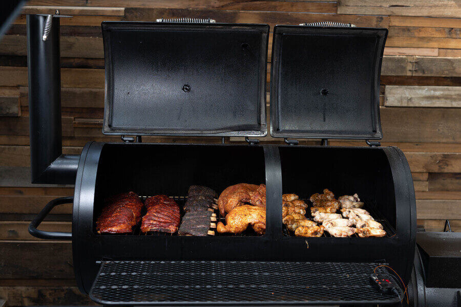 This_image_shows_a_cook_in_the_Flaming_Coals_Offset_Smoker