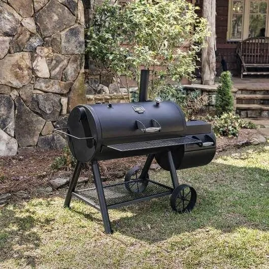 Oklahoma Joe's Longhorn Reverse Flow offset smoker in backyard outdoor cooking setup