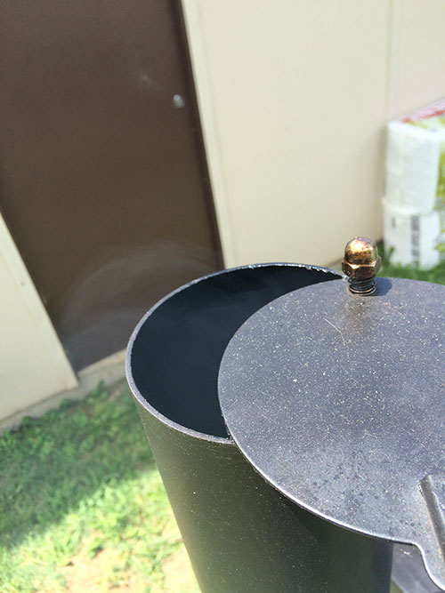 This picture shows the damper that is used to maintain steady temperatures in an Offset Meat Smoker