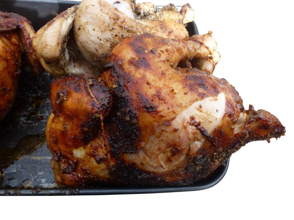 Spit roasted chicken cooked over charcoal