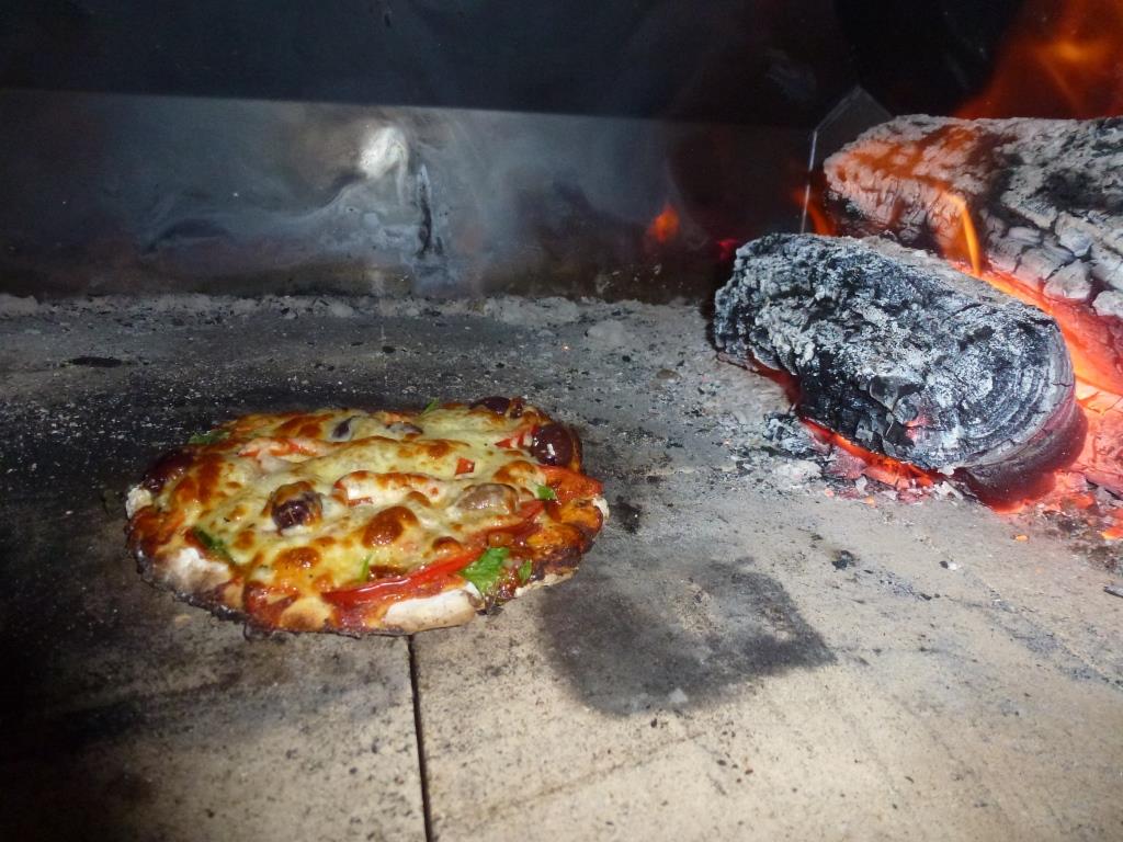 Cooking pizzas in a Wood Fired Pizza Oven