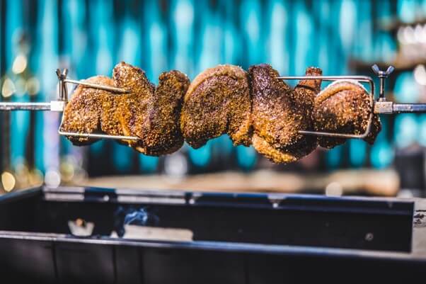 This image shows Picanha Steak on the skewer that has been seasoned all around