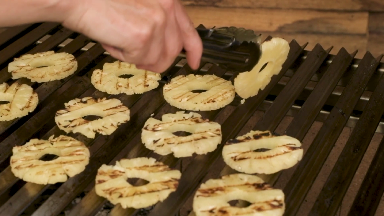 This_image_shows_the_pineapples_on_the_Argentine_Parrilla_BBQ_for_added_zesty_flavour