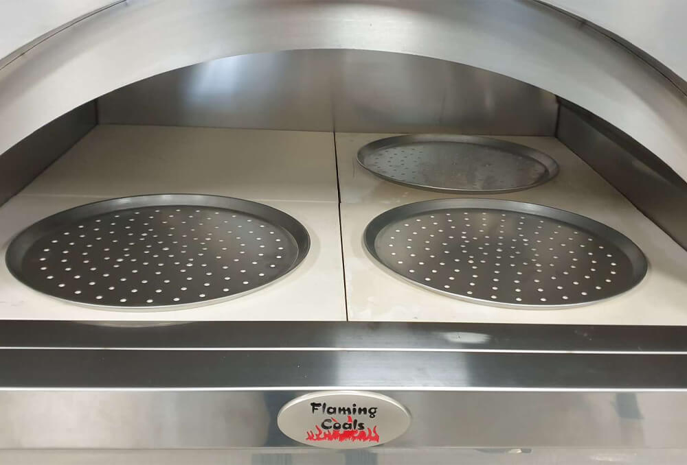 This image shows 3 pizza trays inside the pizza oven