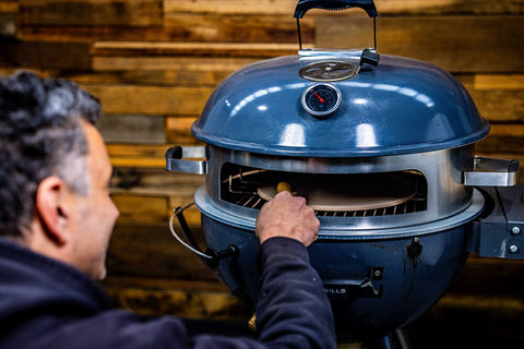 This_image_shows_Pizza_ring_attachment_beingplaced_on_SNS_kettle_Ring