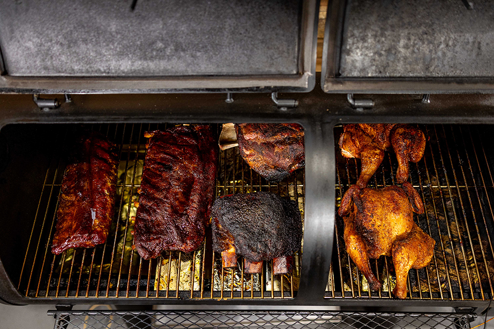This_image_shows_pork_ribs_being_cooked_on_the_smoker