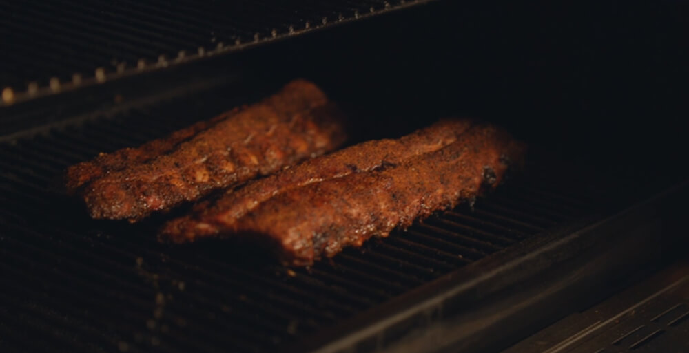 This_image_shows_pork_ribs_on_the_pellet_smoker