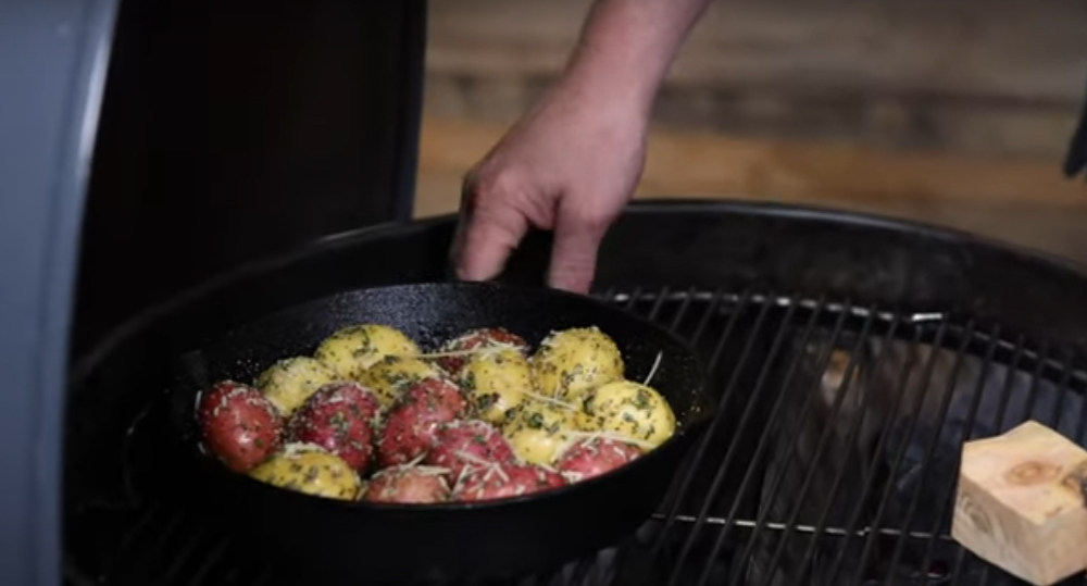 This_image_shows_Skillet_being_placed_on_cooking_grate