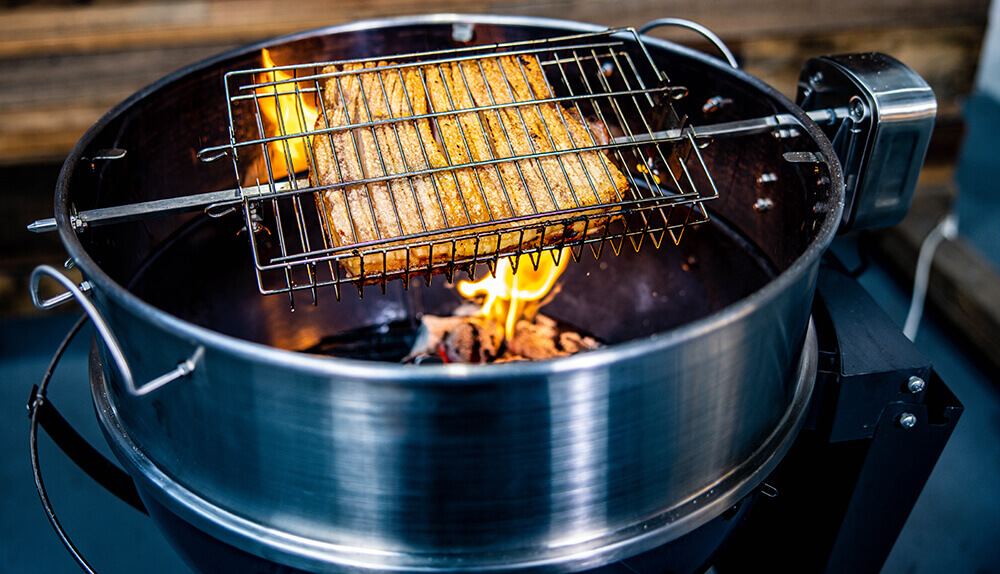 This_image_shows_a_Pork_Belly_cooked_on_a_Kettle_Rotisserie 