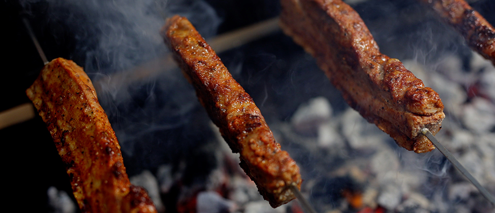 This image shows pork belly cooked in the Cyprus spit