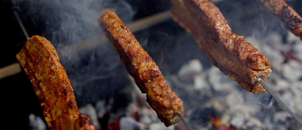 This image shows pork belly cooked in the Cyprus spit