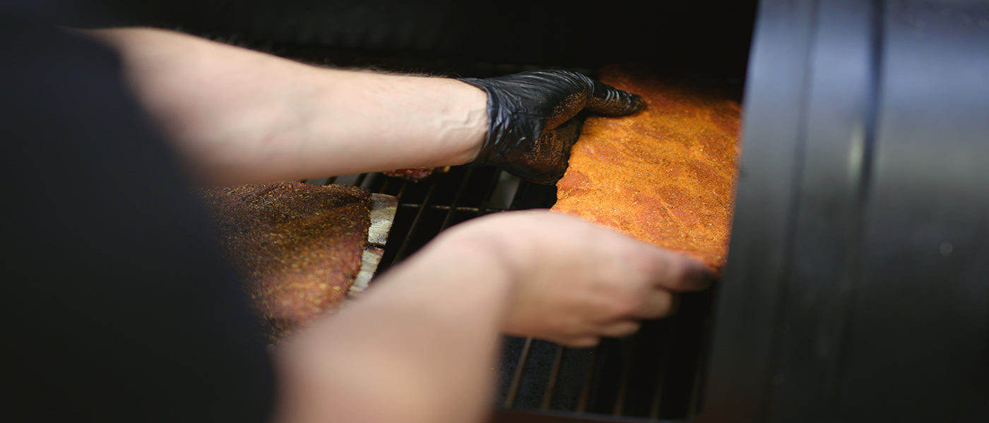 Pork ribs placed on Flaming Coals Offset smoker