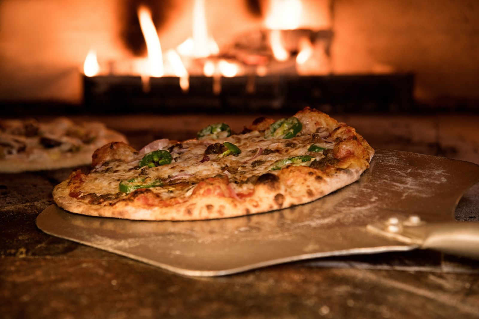 Pizza in a oven (Photo by Eneida Nieves from Pexels)