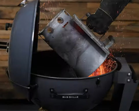 This_image_shows_Lit_charcoal_on_SNS_kettle_BBQ