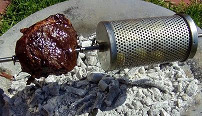 This photo shows a meat cooking on Auspit Rotisserie