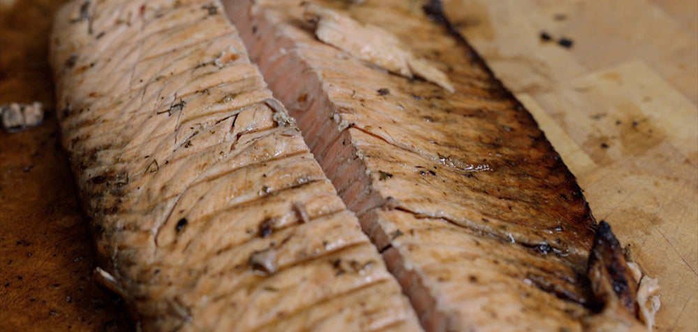 This image shows a delicious salmon removed from cyprus spit rotisseries