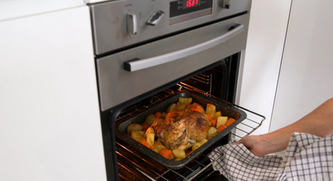 Delicious whole chicken with veggies baked in the oven