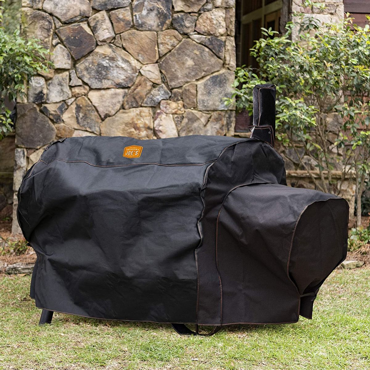 This picture shows the Oklahoma Joe's Longhorn Reverse Flow Cover being used to cover the longhorn Smoker