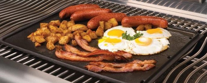 This is a picture of a BBQ being cooked on a Reversible cast iron Griddle