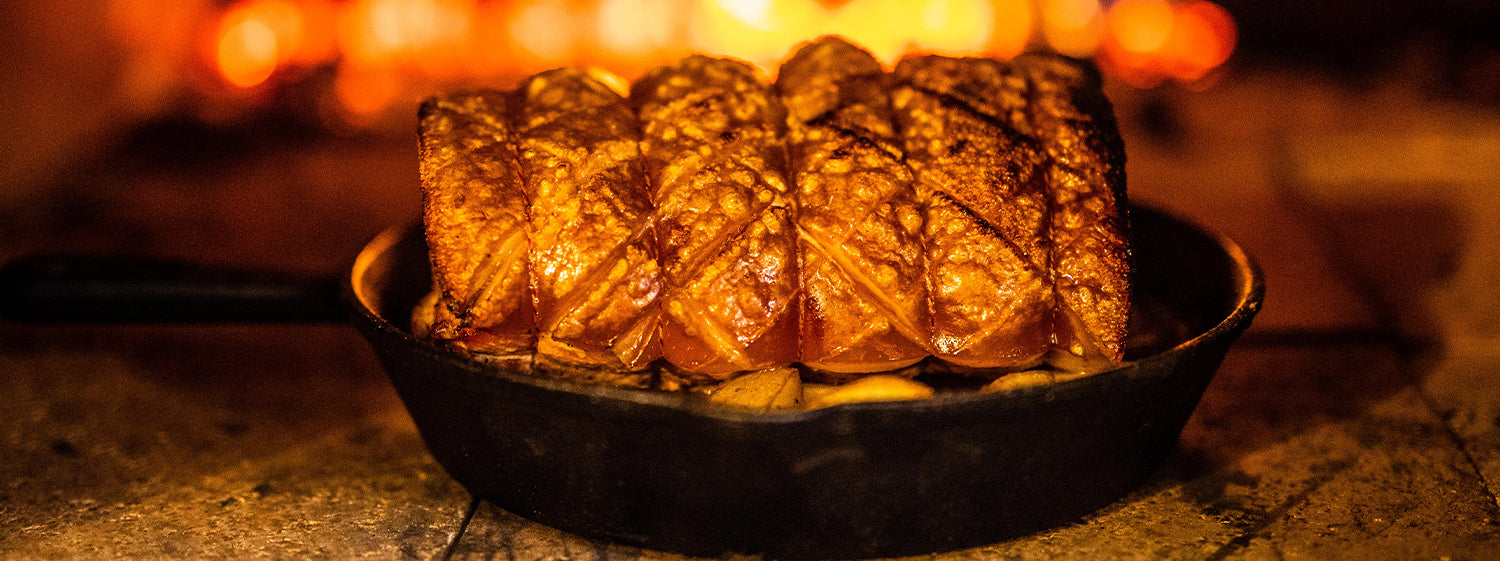 This is a close up image of Rolled Pork Loin cokked in wood fired pizza oven