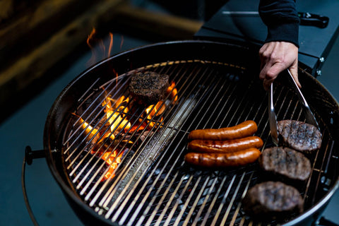 This image shows a sausage and steak on a SNS Kettle