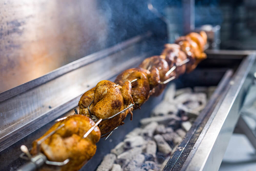 This image shows one of the large spits of Flaming Coals that can cater whole lamb or up to 7 chooks.
