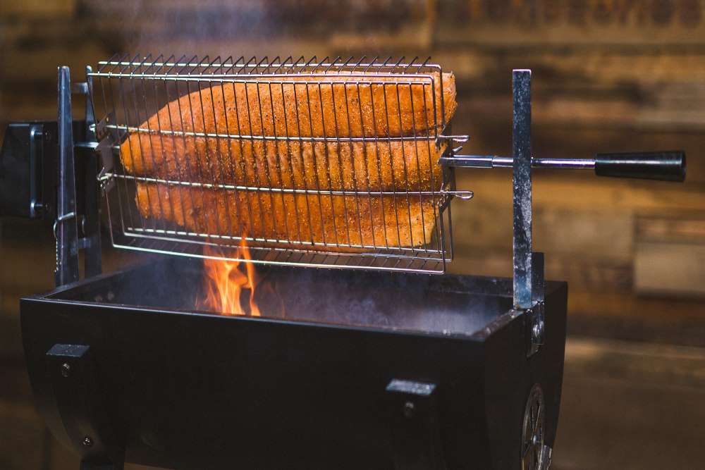 This is a picture of slamon fish being cooked on a jumbuck spit Roaster during the filming of our Jumbuck spit recipe Masterclass