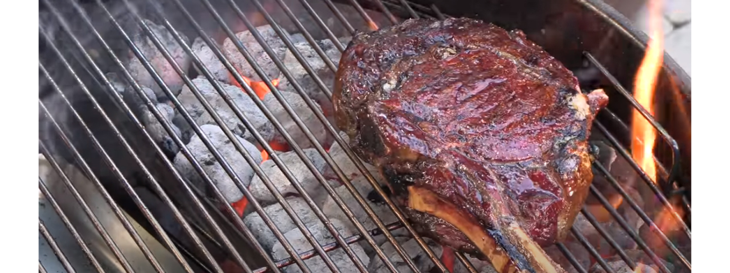 This image shows a reverse seared Tomahawak