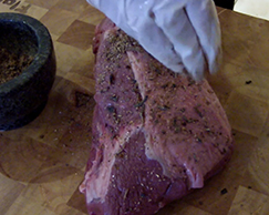This photo shows how to seasoned a meat.