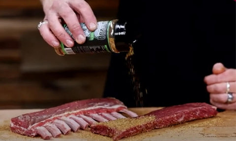 This_image_shows_the_lamb_being_seasoned_with_sheared_and_seared_BBQ_seasoning