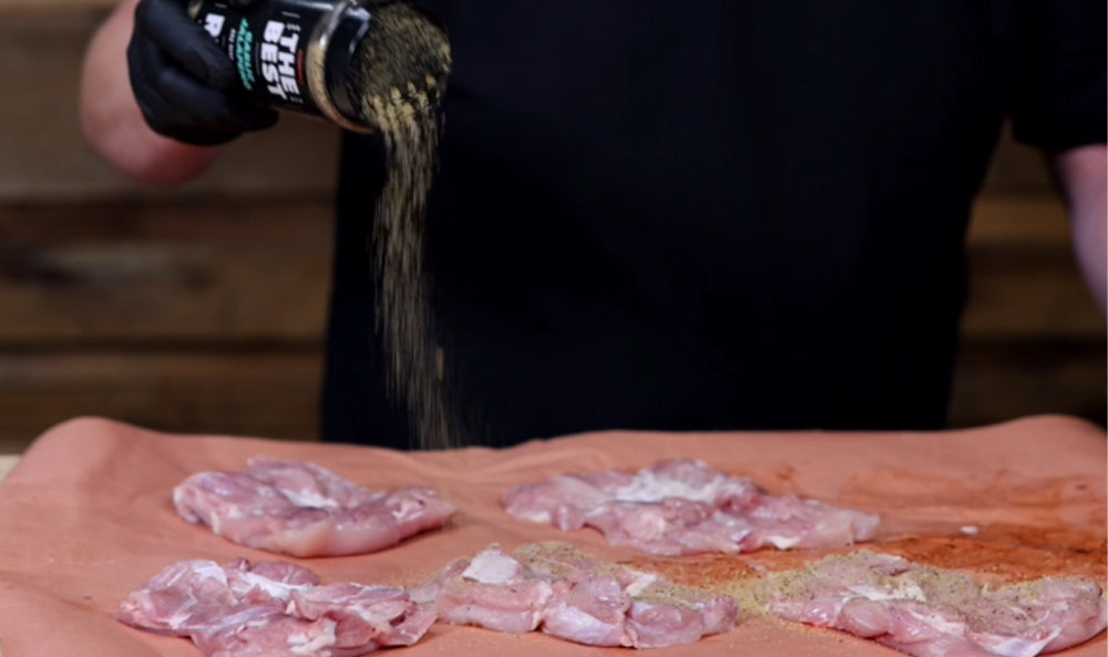 This_image_shows_chicken_being_seasoned_with_kosmos_Q_the_best_Rub
