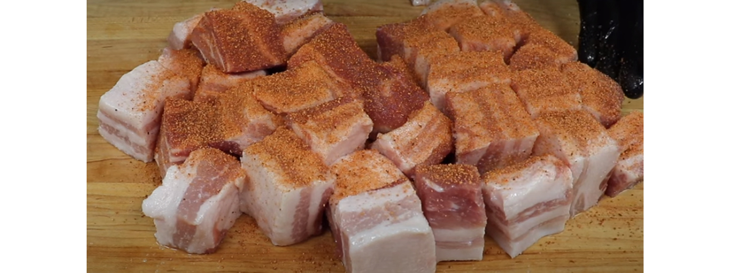 This image shows a seasoned pork belly 