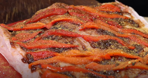 This image shows a seasoned pork loin