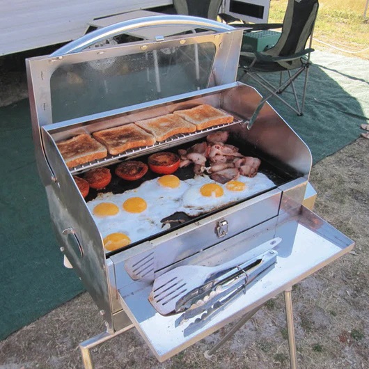 This picture shows the utensil tray attached to a sizzler Deluxe BBQ