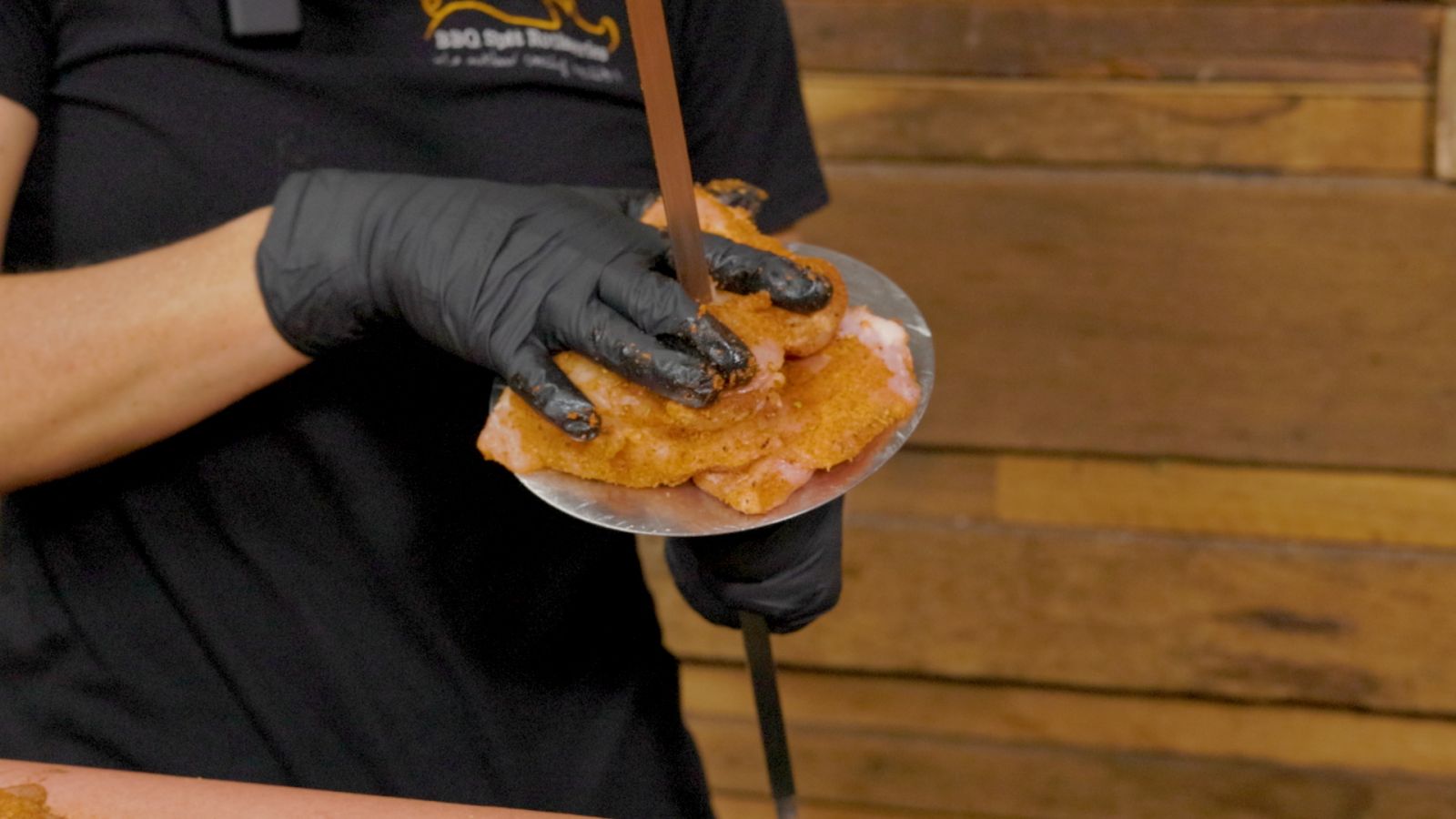 This_image_shows_placing_chickens_to_the_skewer